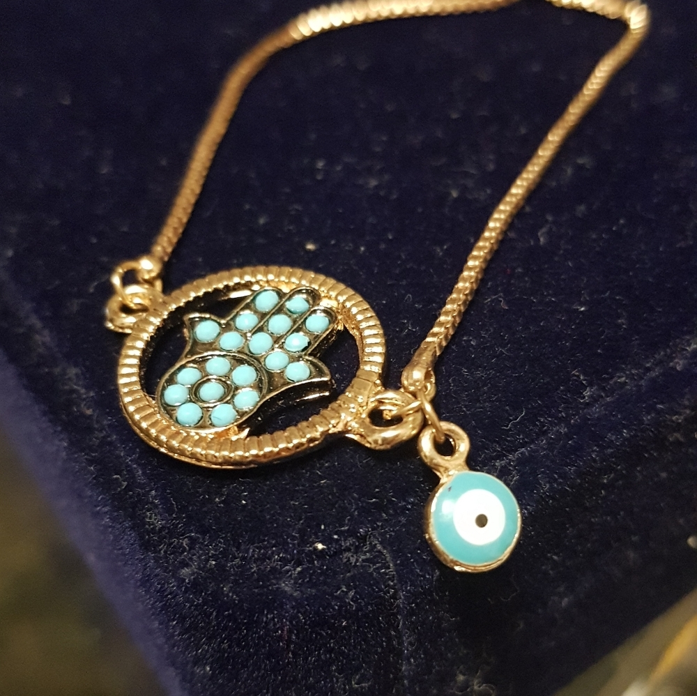 Beautiful Hamsa bracelet in turquoise beads .